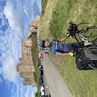 Lucas in front of Bamburgh castle